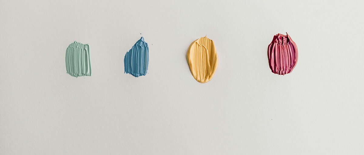 light blue, dark blue, yellow and pink paint daubs